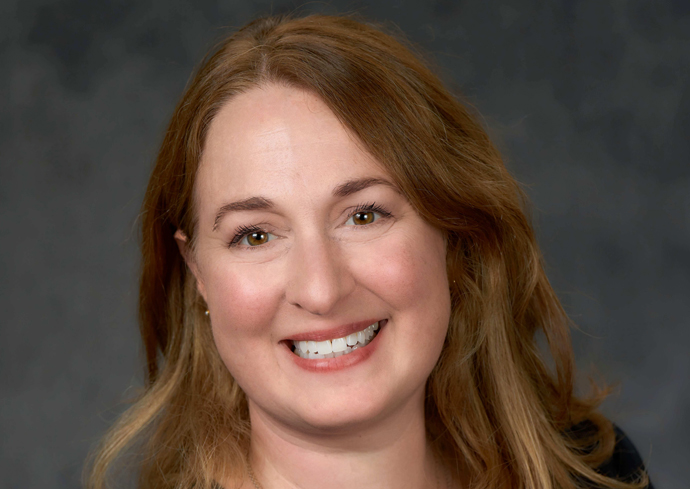 Following is the description of the image that was sent with the previous user message:The image shows a person with long, wavy brown hair against a dark, neutral background.